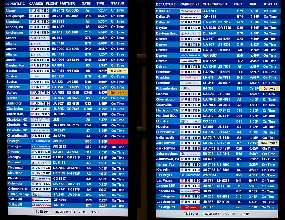 Airport arrivals and departures board listing flight destinations