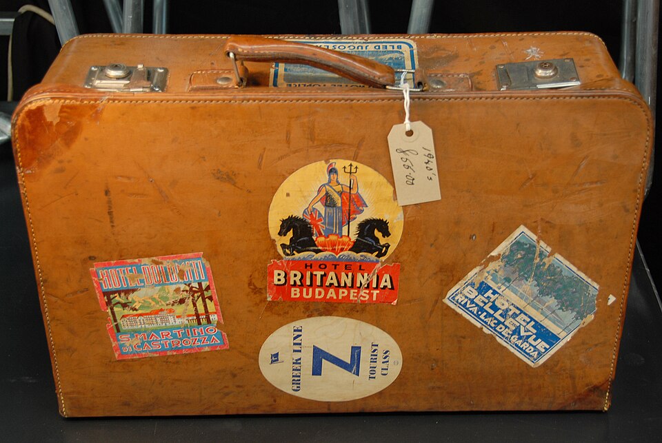 Suitcase covered with travel labels