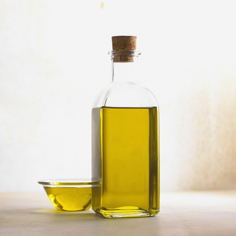 A bottle of olive oil used for cooking